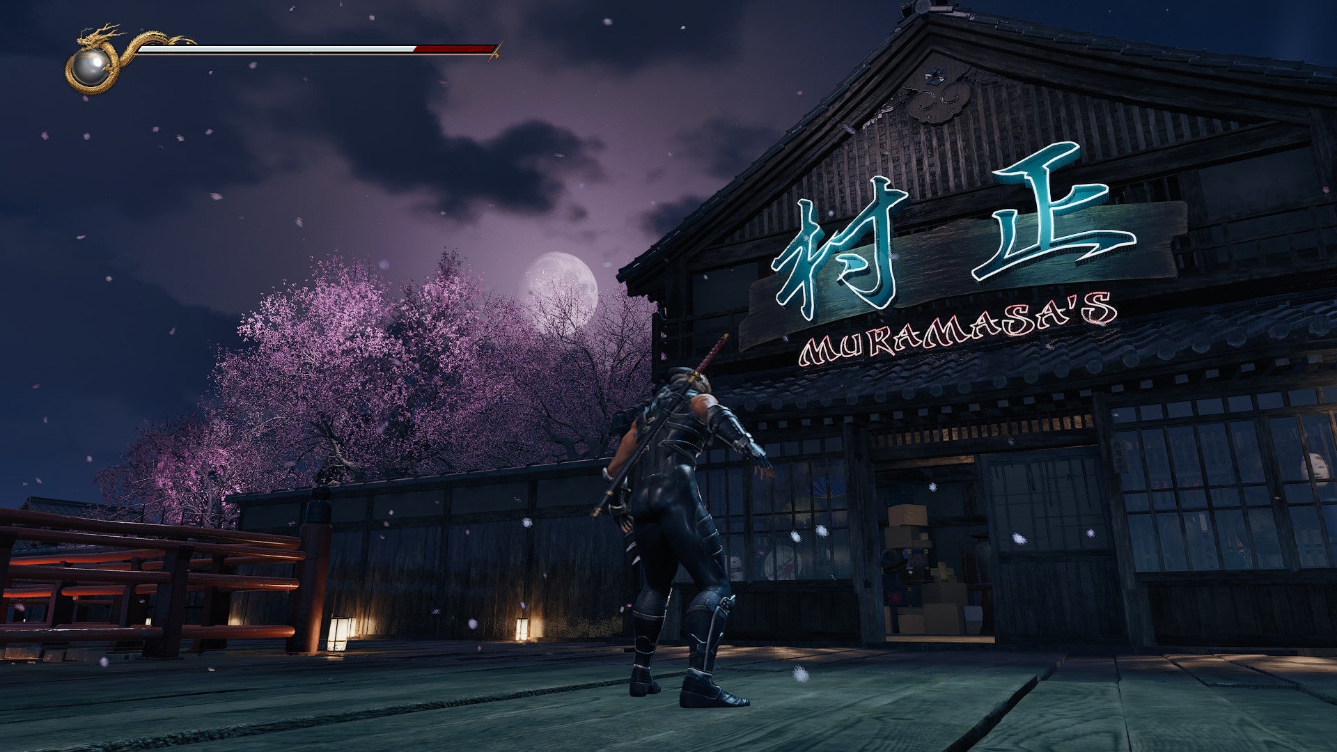 Ryu standing outside of Muramasa's shop in Ninja Gaiden 2 Black. - 4