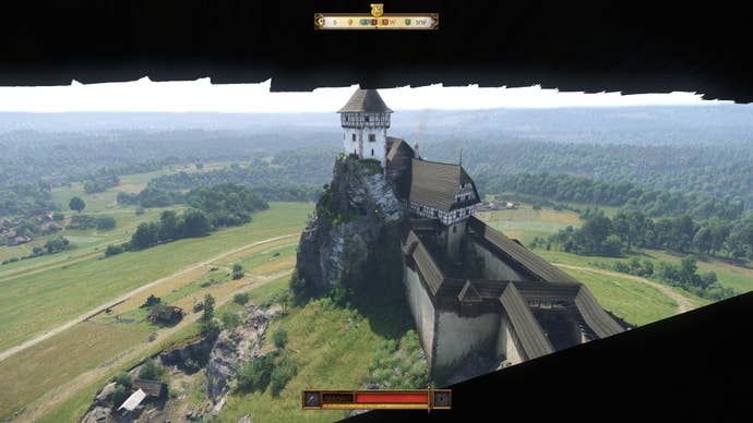 A view of an imposing hilltop castle from one of the castle’s towers in Kingdom Come: Deliverance 2