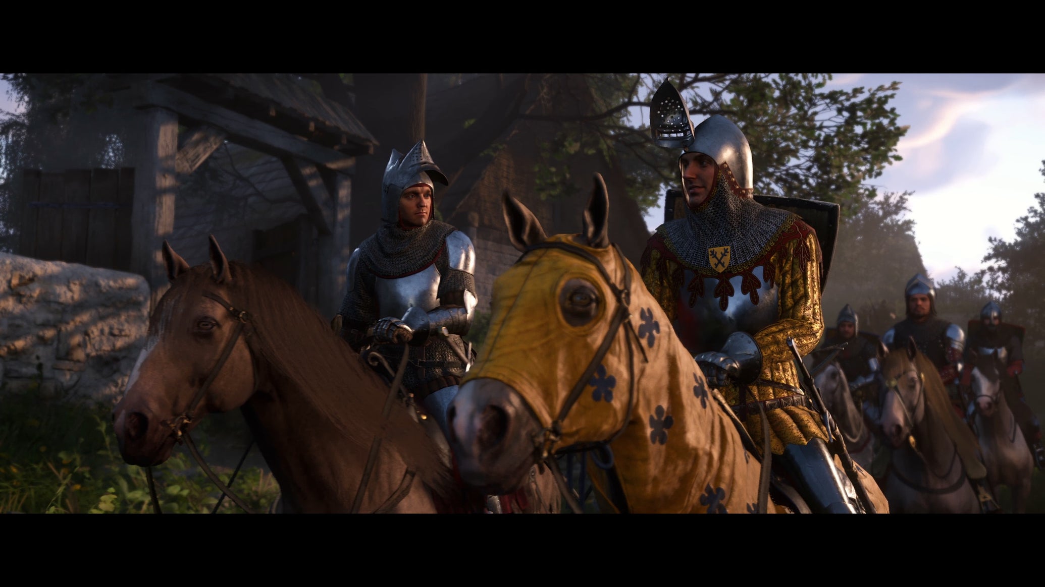 Two men in armour riding on horses in Kingdom Come: Deliverance 2 - 1