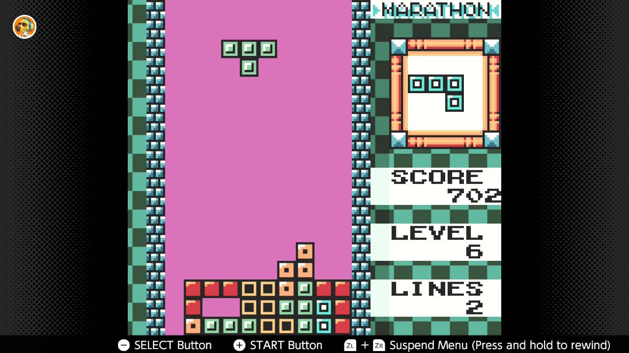 A screen from Tetris DX showing a falling T Block.