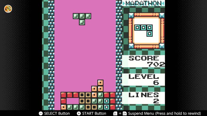 A screen from Tetris DX showing a falling T Block.