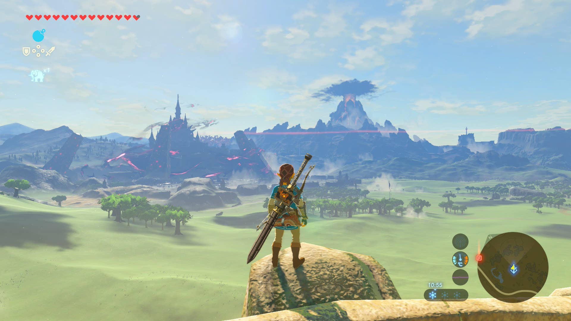 Link takes in the vista of Hyrule with Mount Doom in the distance in Breath of the Wild.
