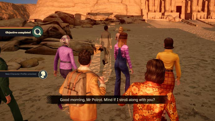 Screenshot from Agatha Christie’s Death on the Nile of Hercule Poirot and the rest of the Karnak’s passengers walking toward the Temple of Abu Simbel while one of them says “Good morning, Mr. Poirot. Mind if I stroll along with you?”