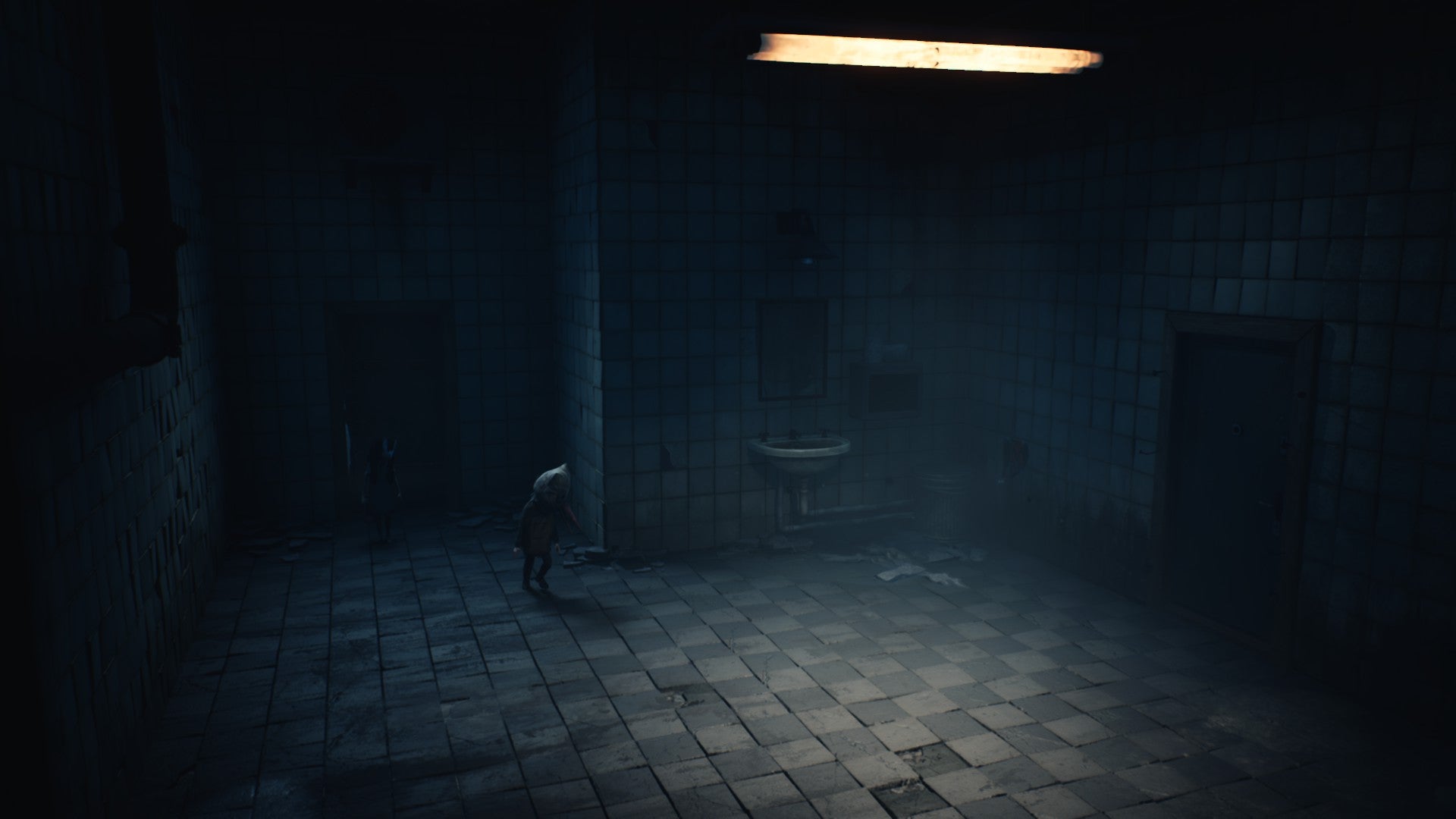 A tiled room with a toilet in Reanimal.