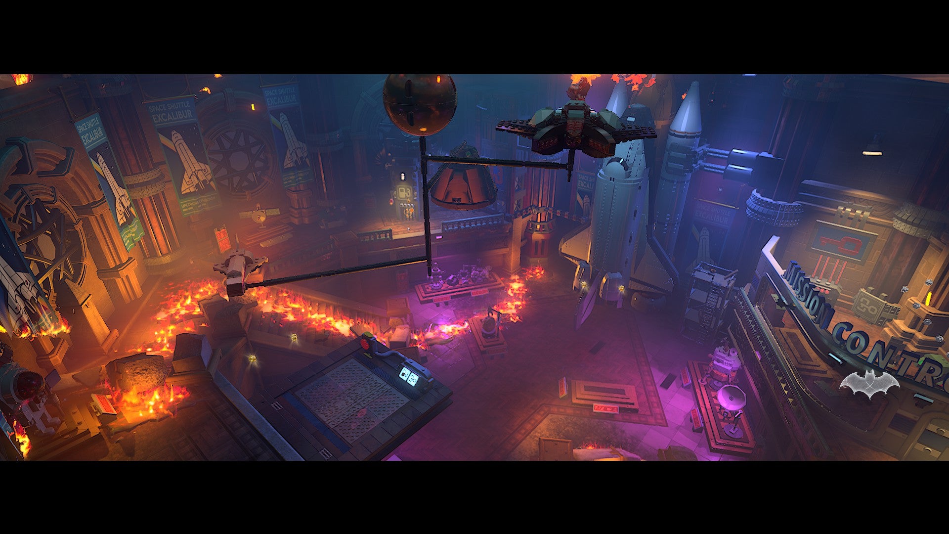 Lego Batman: Legacy of the Dark Knight screenshot showing you gliding over a purple and red Gotham
