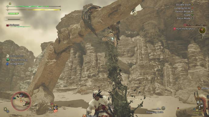 A Balahara perched on a pillar above shoots mucus down at a hunter in Monster Hunter Wilds.