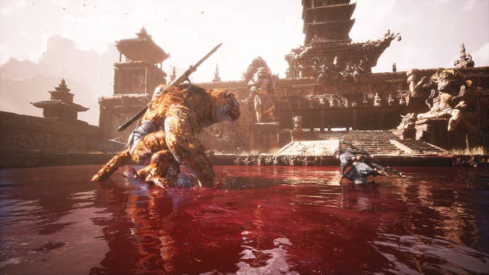 The Destined One and Tiger Vanguard stand in the middle of a pool of blood in Black Myth: Wukong, about to fight to the death.