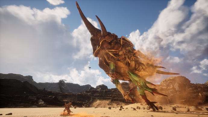 The giant beetle Fuban explodes out from the sand in the Kingdom of Sahali, a hidden area in Black Myth: Wukong’s Chapter 2.