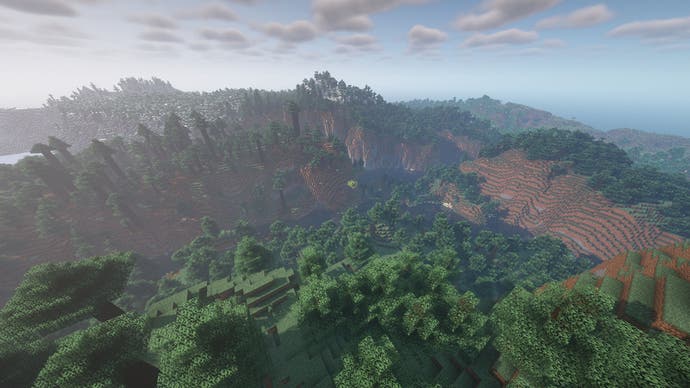 Eine Minecraft-Landschaft mit gewundenen Hügeln und bewaldeten Tälern.