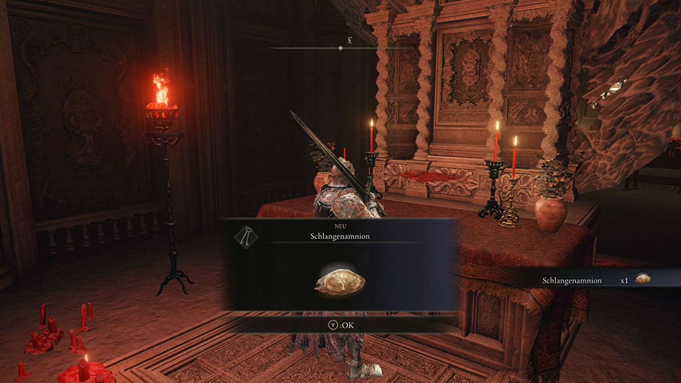 A warrior collects the Serpent&rsquo;s Amnion from an altar in Elden Ring