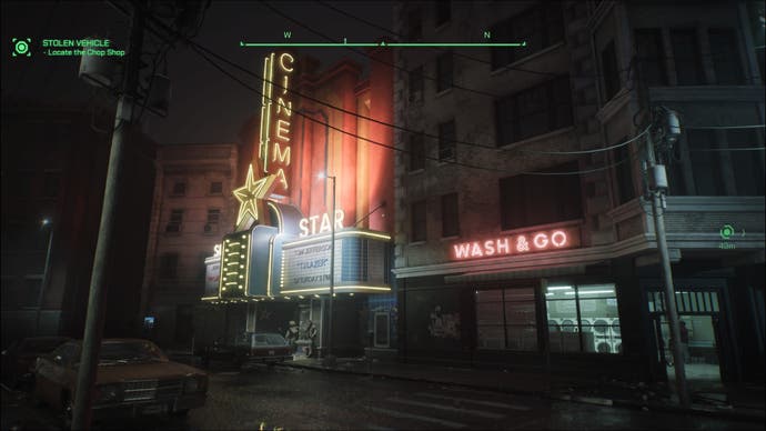 A screenshot of RoboCop: Rogue City, showing a cinema and a laundrette illuminated at night by their neon signs.