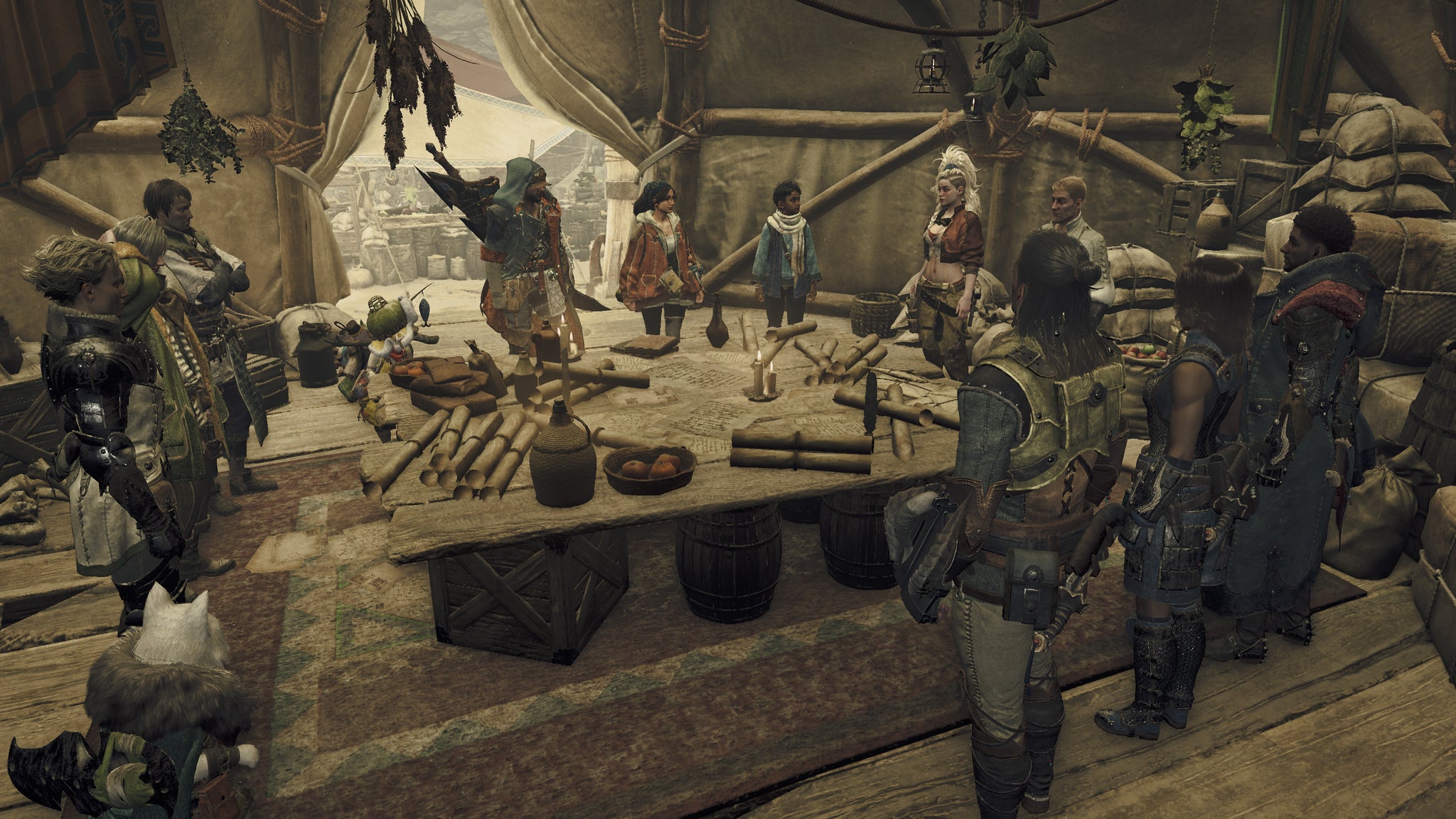 A group of hunters stand around a table in the middle of a tent, planning an expedition in Monster Hunter Wilds. - 5