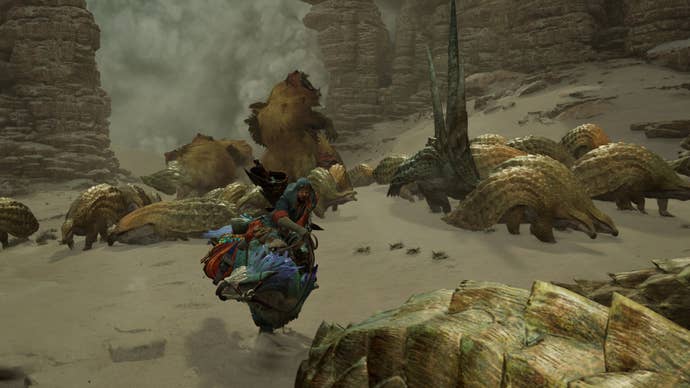 A herd of small scaly monsters fighting big furry ones in Monster Hunter Wilds