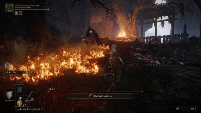 A warrior navigates an enflamed boss arena with the Omen Killer in Elden Ring.