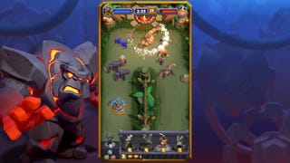 A screenshot from Warcraft Rumble showing the player's army following a U-shaped path, viewed from above, and tackling enemies along the way.