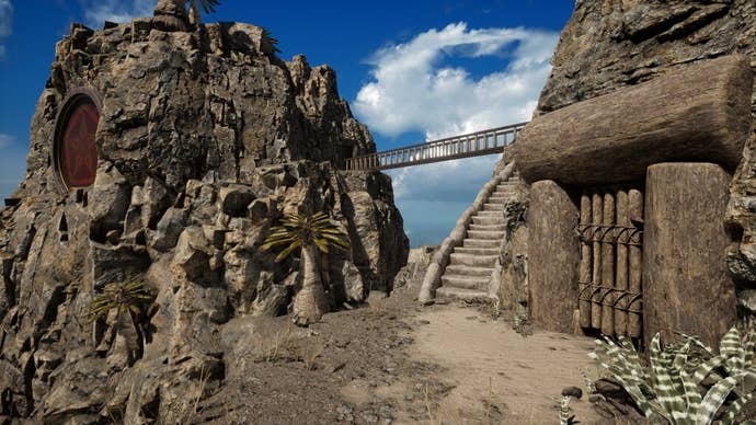 A view of a staircase leading up a cliffside from a wooden door, with a bridge further off leading to a stony outcrop, in the Riven remake