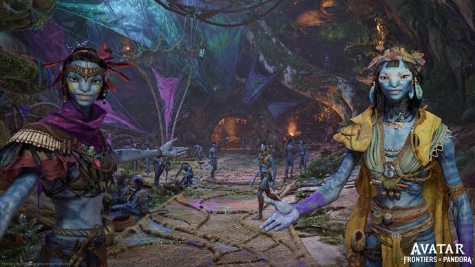 A first-person shot of a Na'vi settlement in Ubisoft Massive's Avatar: Frontiers of Pandora, an adaptation of the James Cameron movie, with two characters welcoming you in.
