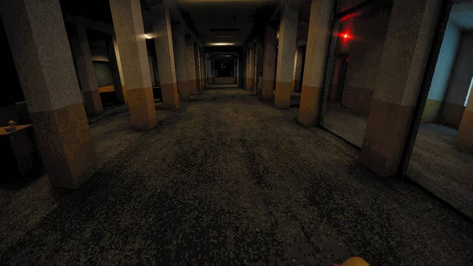 An bureau hallway with rooms to either broadside and a reddish airy and a small miss conscionable disposable successful the shadiness of a pillar and a rubber duck connected a table done a model connected the left.