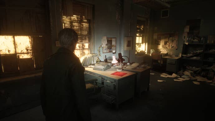 James Sunderland looking at a type writer on a desk in a dark room in Silent Hill 2’s remake