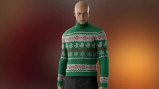 Agent 47 wears a new festive jumper as he looks sternly at the camera. The jumper is predominantly green, with ducks and snowflakes depicted in white on the design