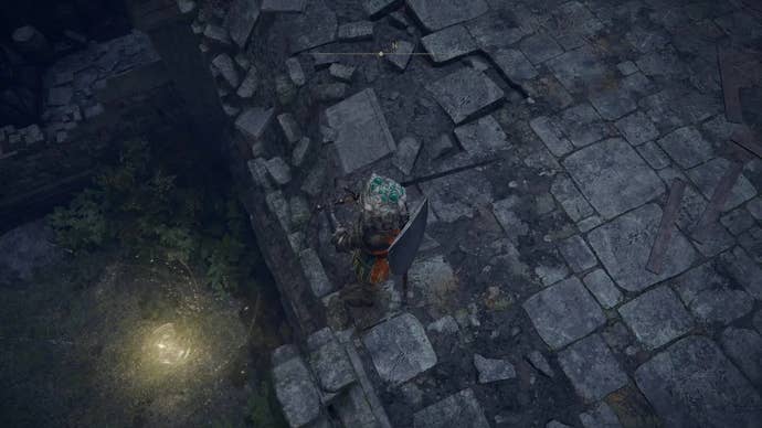 A warrior stands on the edge of a crumbling rampart in Castle Morne in Elden Ring.