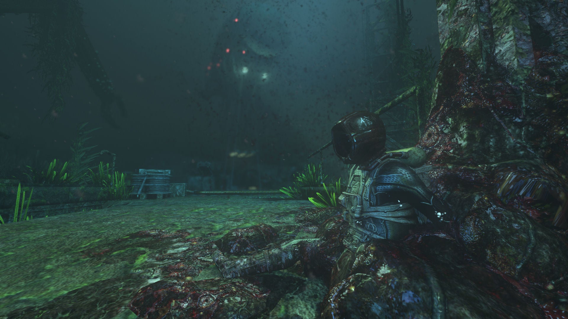 A deepsea diver tangled up in fleshy metal cables on the ocean floor in Soma.