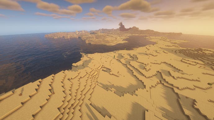 Ein weitläufiges Wüstenbiom an der Küste in Minecraft, in dem meilenweit keine Bäume zu sehen sind.