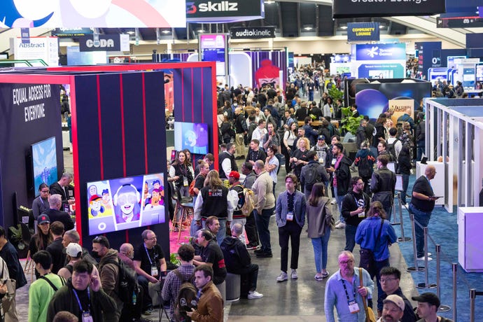 The GDC 2024 show floor, with people walking amongst stands