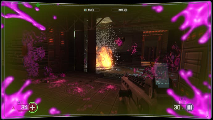 A screenshot of Selaco, showing an explosion spraying purple alien blood everywhere.