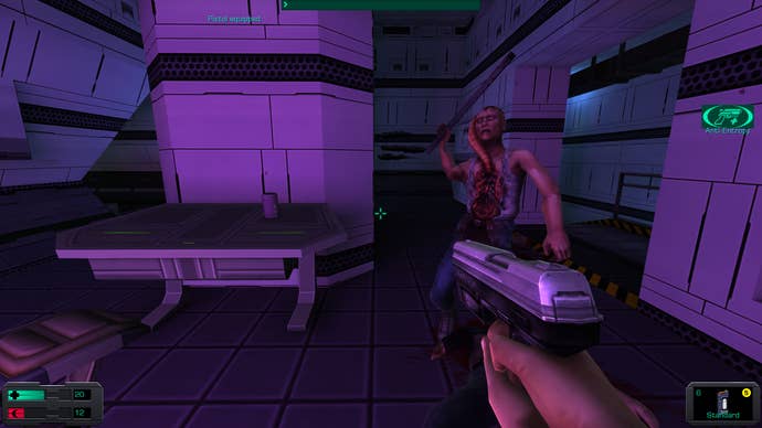 5. A screenshot of System Shock 2: 25th anniversary remaster, showing the player wielding a pistol as a hybrid attacks the player with a lead pipe.