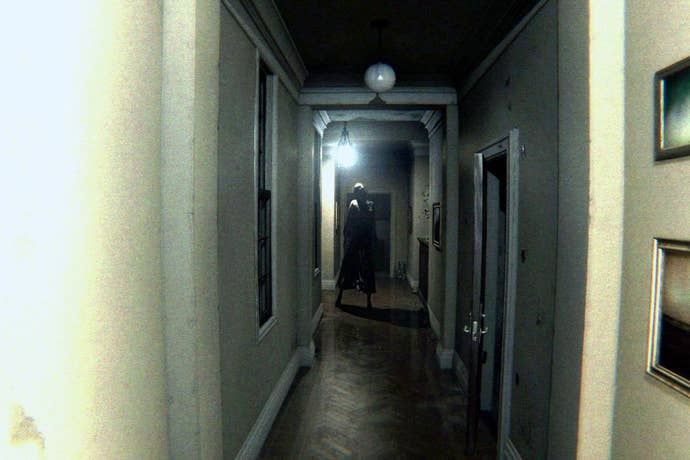 A corridor in PT with a mysterious figure standing at the end.