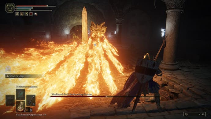 A warrior fights a flame-spewing boss in the Impaler's Catacombs in Elden Ring