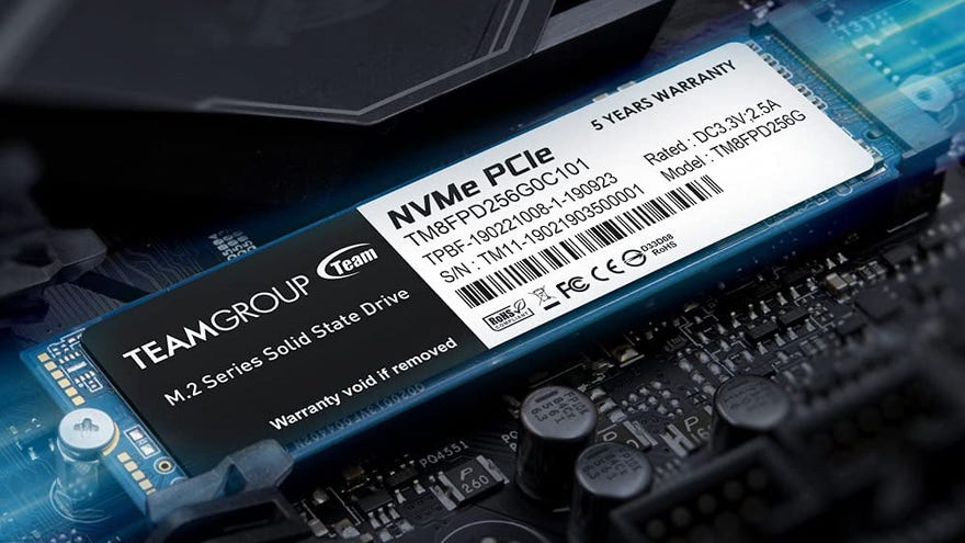 a photo of a teamgroup mp33 pro nvme ssd inserted into a motherboard; the words ‘five years warranty’ are highlighted.