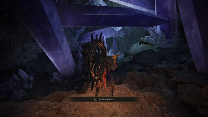 A warrior stands in a corridor in the Sellia Hideaway in Elden Ring.