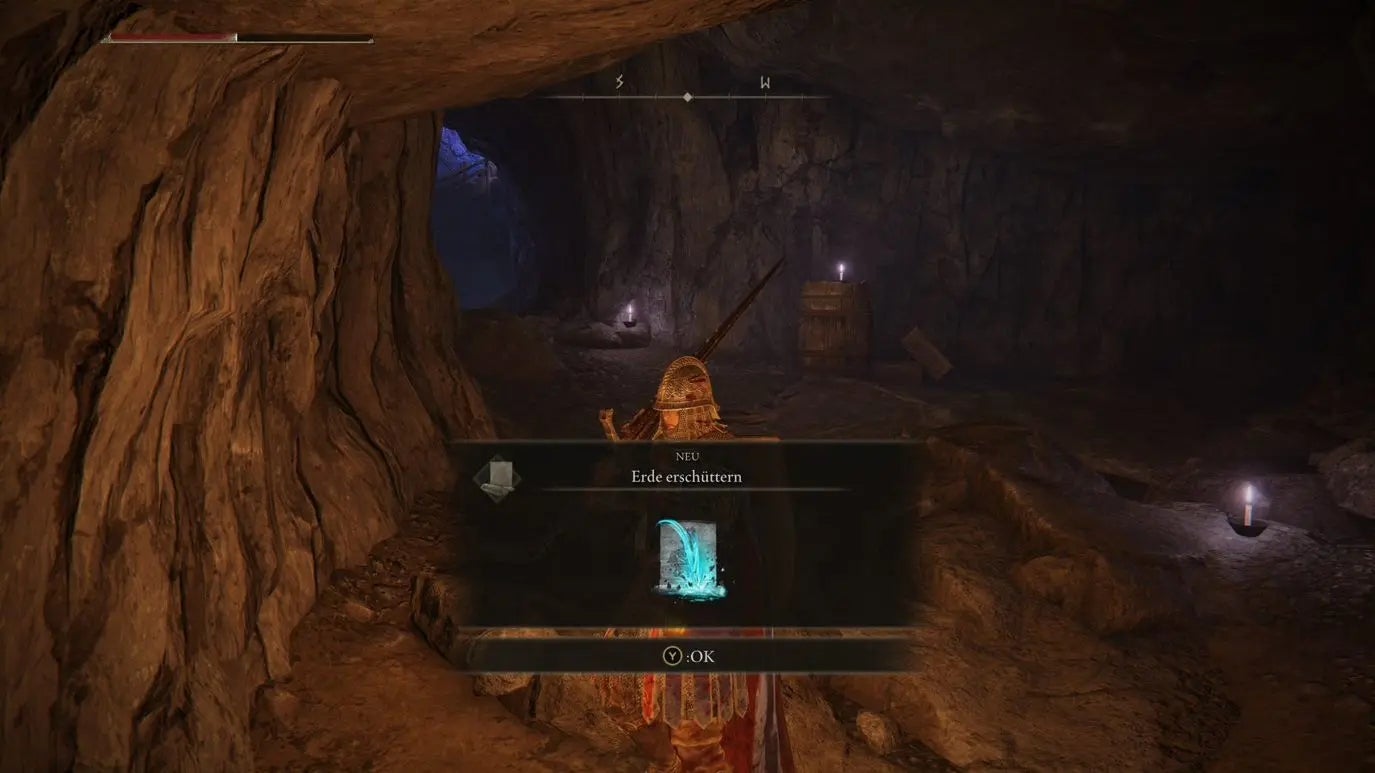 A warrior picks up a Sorcery spell in the Raya Lucaria Crystal Tunnel in Elden Ring.
