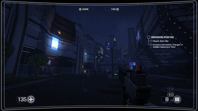 A screenshot of Selaco, showing the player at the end of a street in a futuristic cityscape at night.