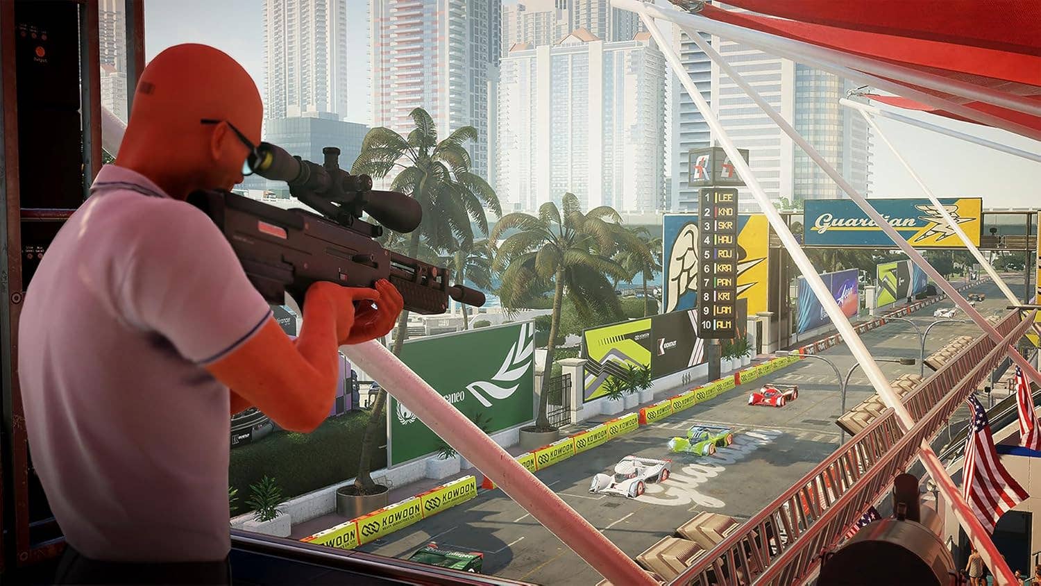 A man aiming a sniper rifle at a race track