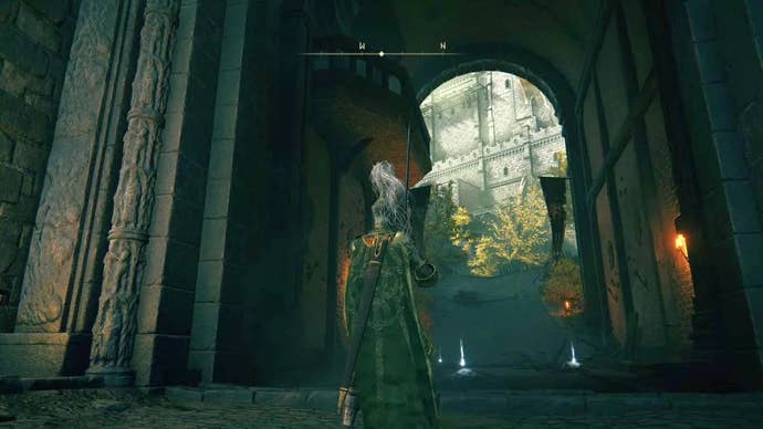 A knight approaches a large main gate inside Stormveil Castle in Elden Ring