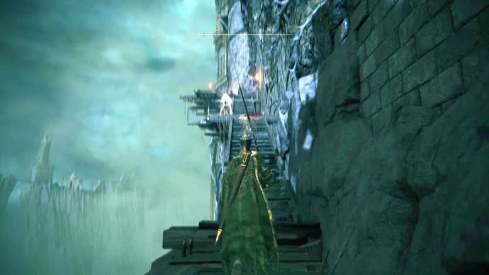 A knight climbs some wooden steps on the outside of Stormveil Castle in Elden Ring