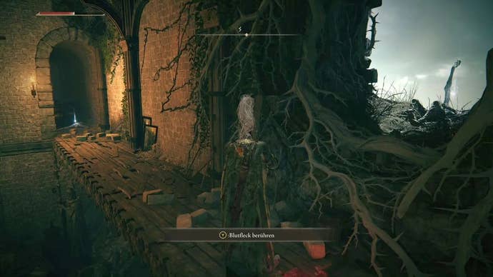 A knight stands in front of an open hole in the wall of Stormveil Castle in Elden Ring.