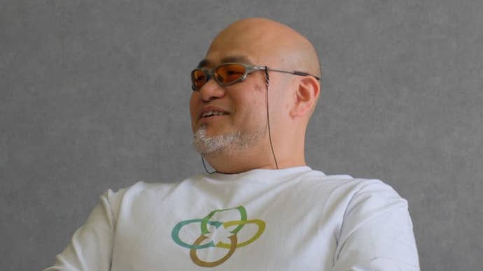 Close up of Hideki Kamiya in white Clovers jumper smiling