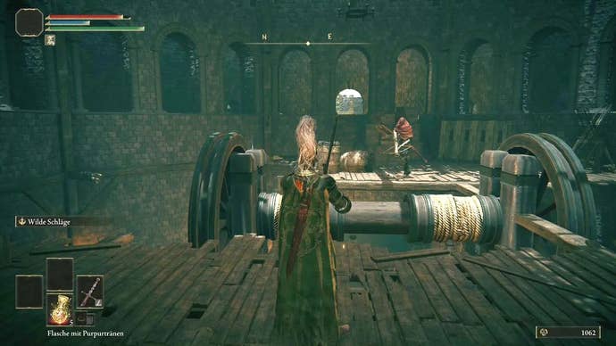 A knight stands in front of a lift mechanism inside Stormveil Castle in Elden Ring