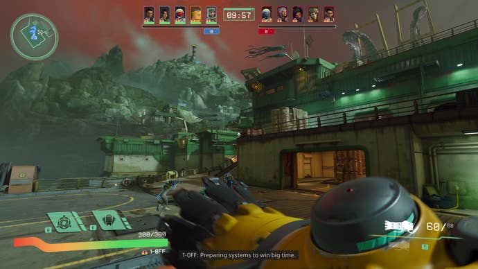 A screenshot of Concord, showing a colony with rusted green prefab structures built around a rocky mountain.