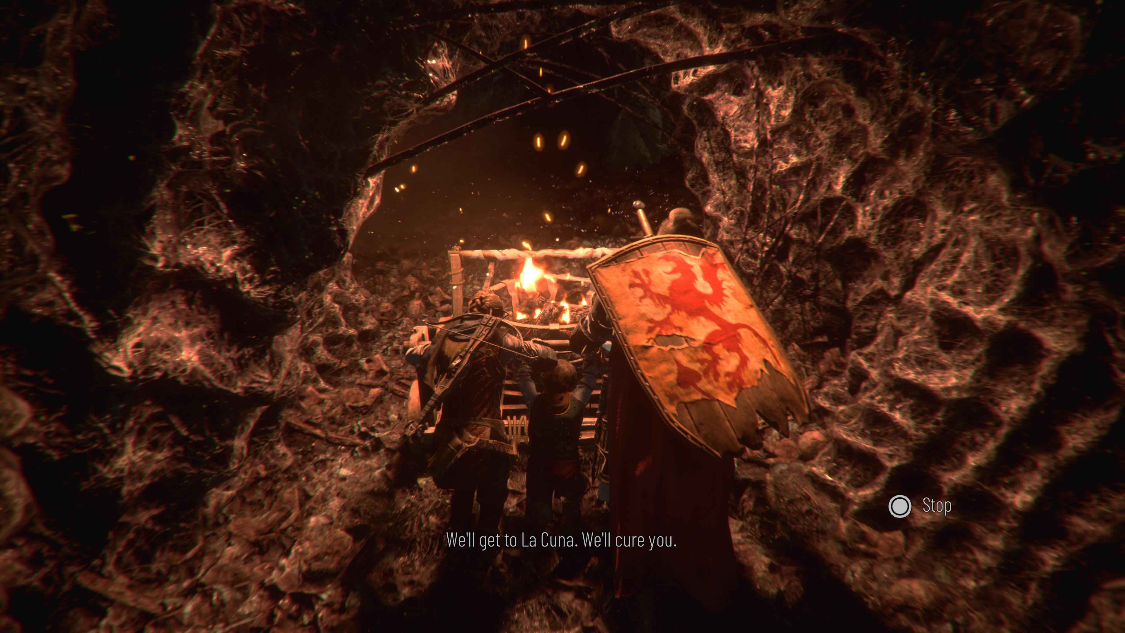 The interior of a rat&rsquo;s nest, where three heroes push a cart in the darkness with a flame on.