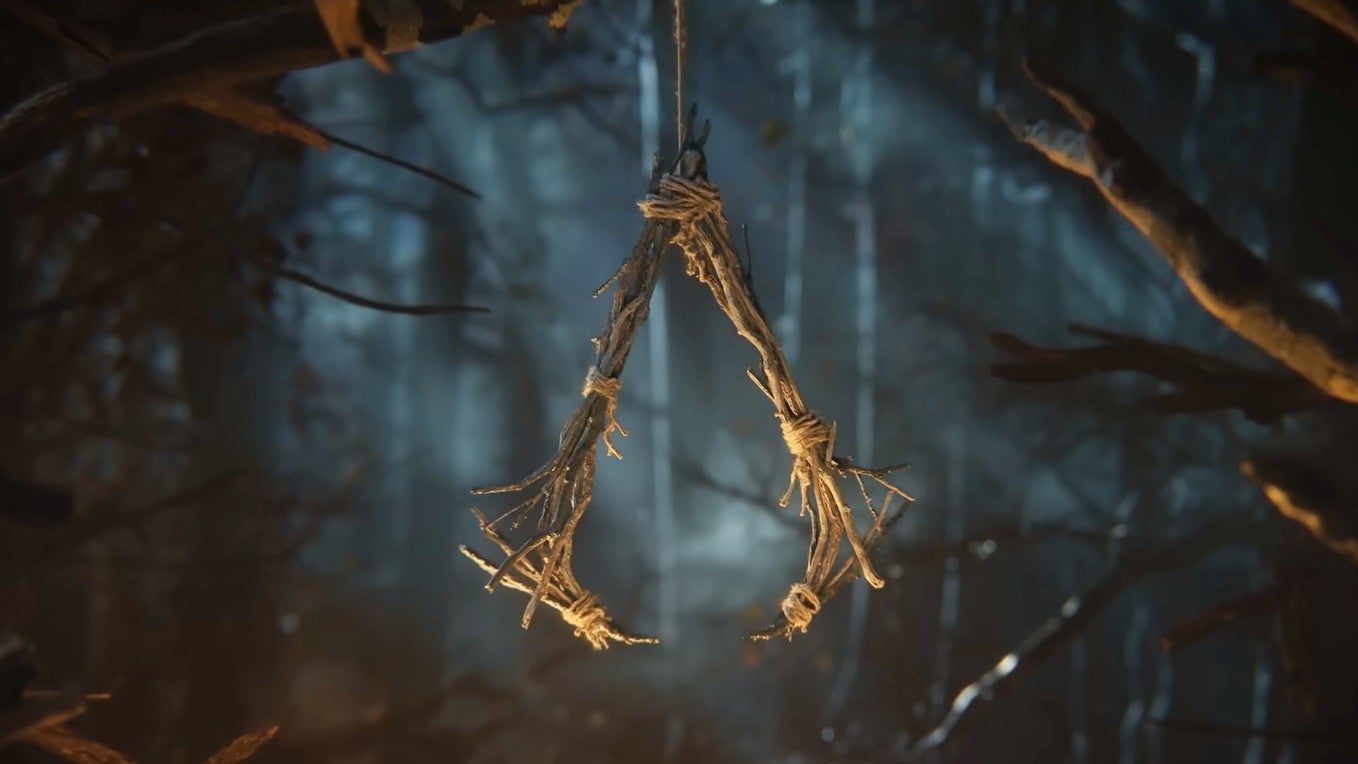 A totem made from sticks shaped like the Assassin's Creed logo in the short teaser for Hexe