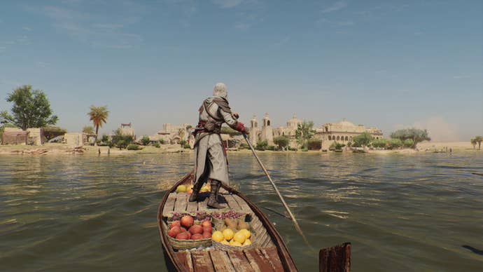 Basim rides a boat full of fruit through a lake in Assassin’s Creed Mirage