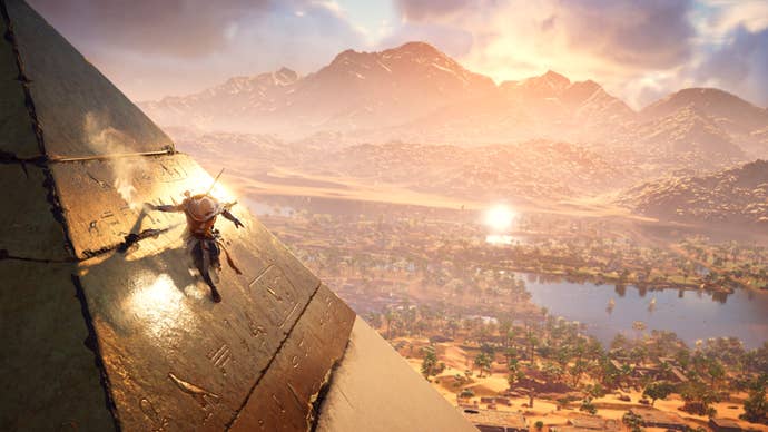 Bayek slides down the side of a Pyramid in Assassin’s Creed Origins.