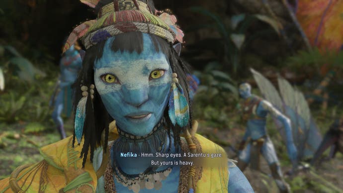 Avatar: Frontiers of Pandora screenshot showing A close-up of fellow Na'vi Nefika as she looks closely at you.