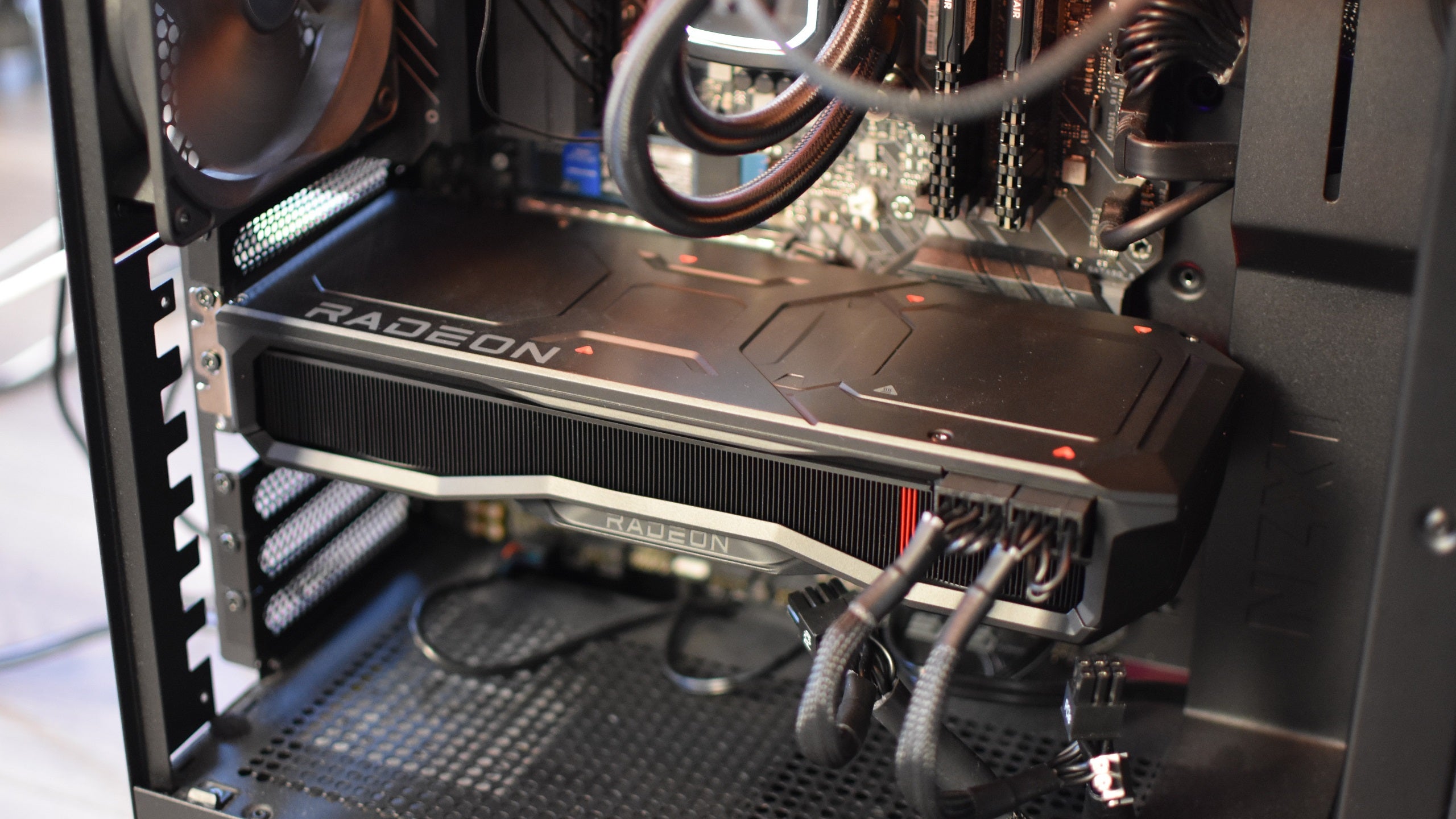 The AMD Radeon RX 7900  XTX graphics card, installed and running inside a gaming PC.