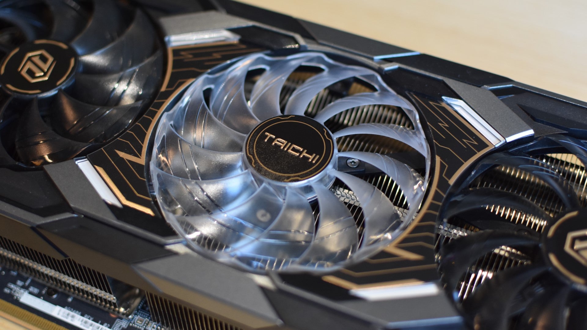 A closeup of the central cooling fan on a ASRock Radeon RX 9070 XT Taichi 16GB OC graphics card. - 3
